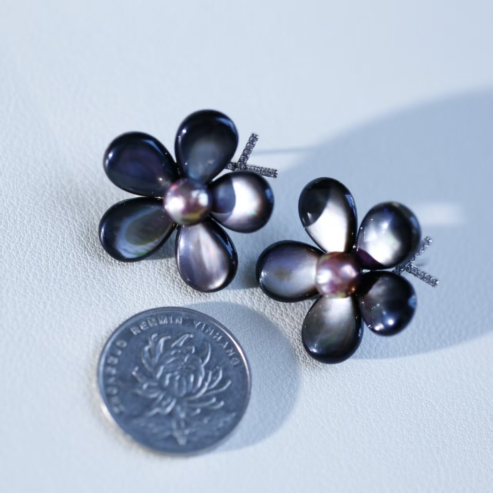 Elegant hand-woven black butterfly shell paired with freshwater metal shiny round pearl stud earrings, fashionable female ear accessory