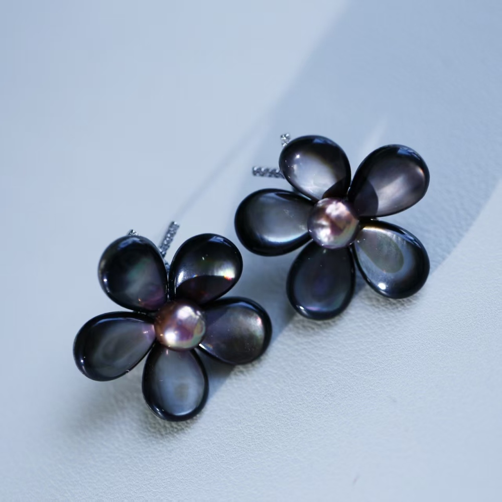 Elegant hand-woven black butterfly shell paired with freshwater metal shiny round pearl stud earrings, fashionable female ear accessory