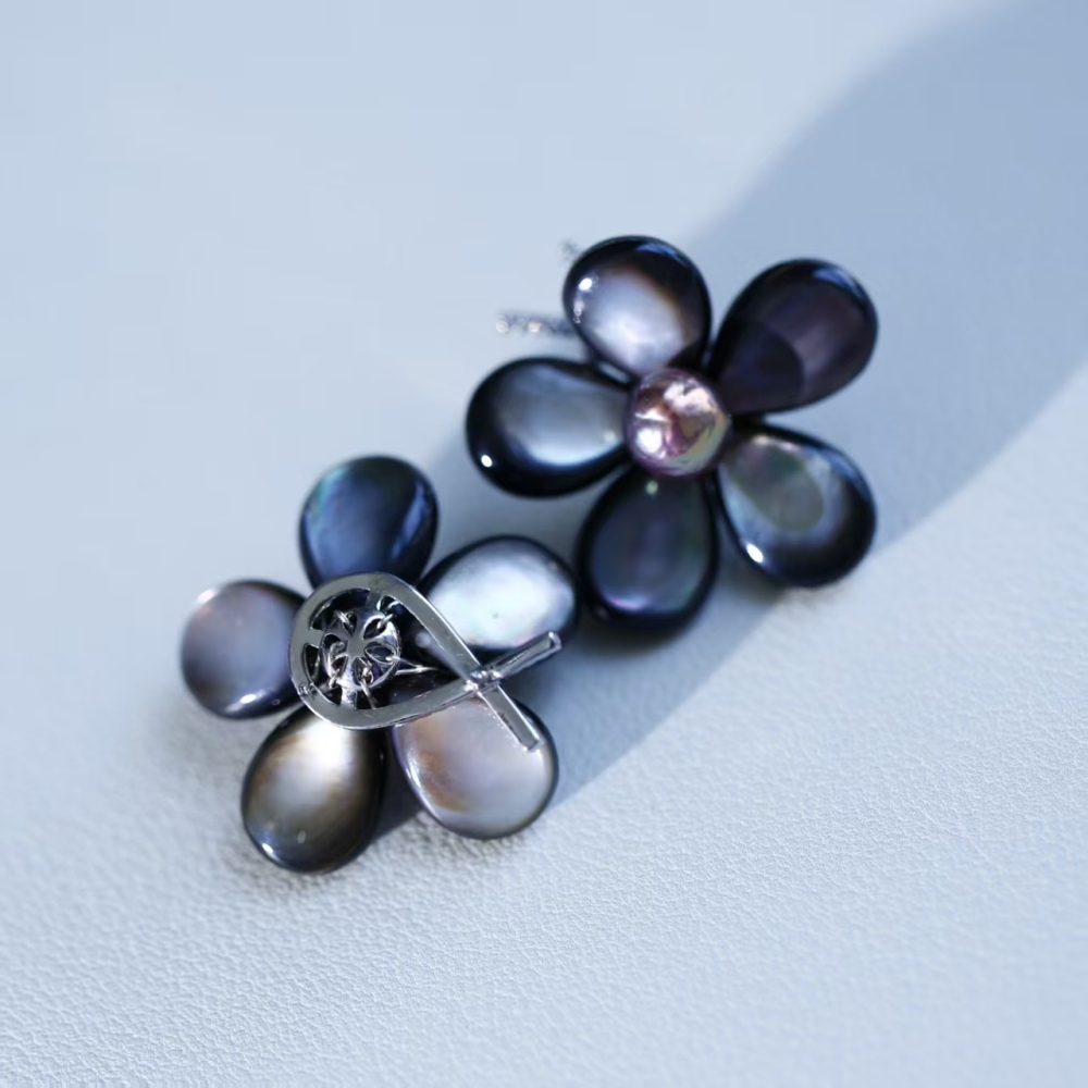 Elegant hand-woven black butterfly shell paired with freshwater metal shiny round pearl stud earrings, fashionable female ear accessory