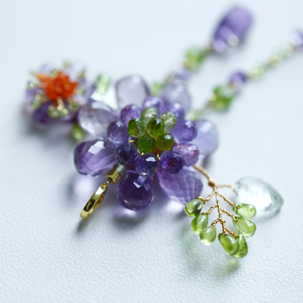 Hand-woven amethyst paired with peridot fire opal flower pendant