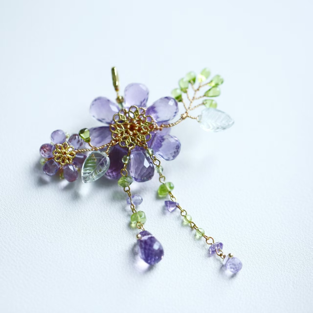 Hand-woven amethyst paired with peridot fire opal flower pendant