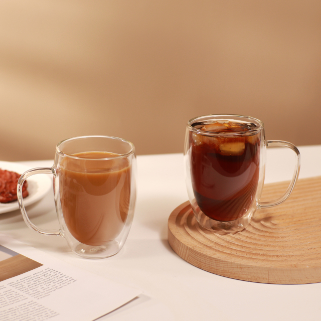 Side view of double wall glass mug with ergonomic handle