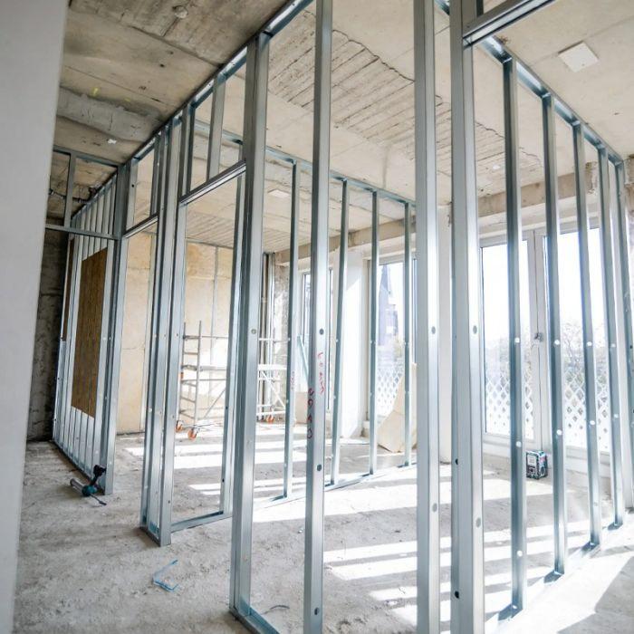 Metal stud and track framing for drywall partition systems