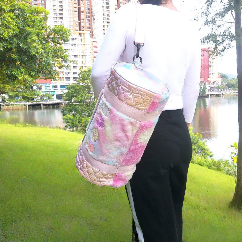 Iridescent knitted fabric, cylindrical travel and fitness bag.