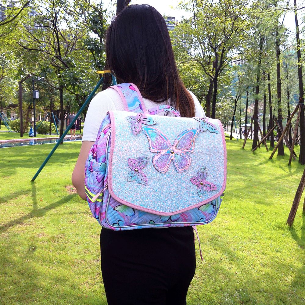 Butterfly decorations, flip-top covers, and student schoolbags