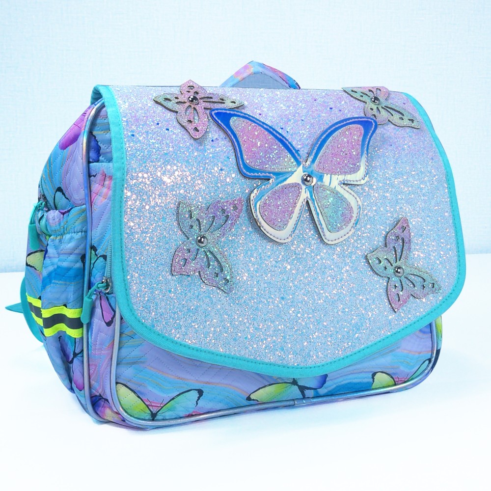 Butterfly decorations, flip-top covers, and student schoolbags