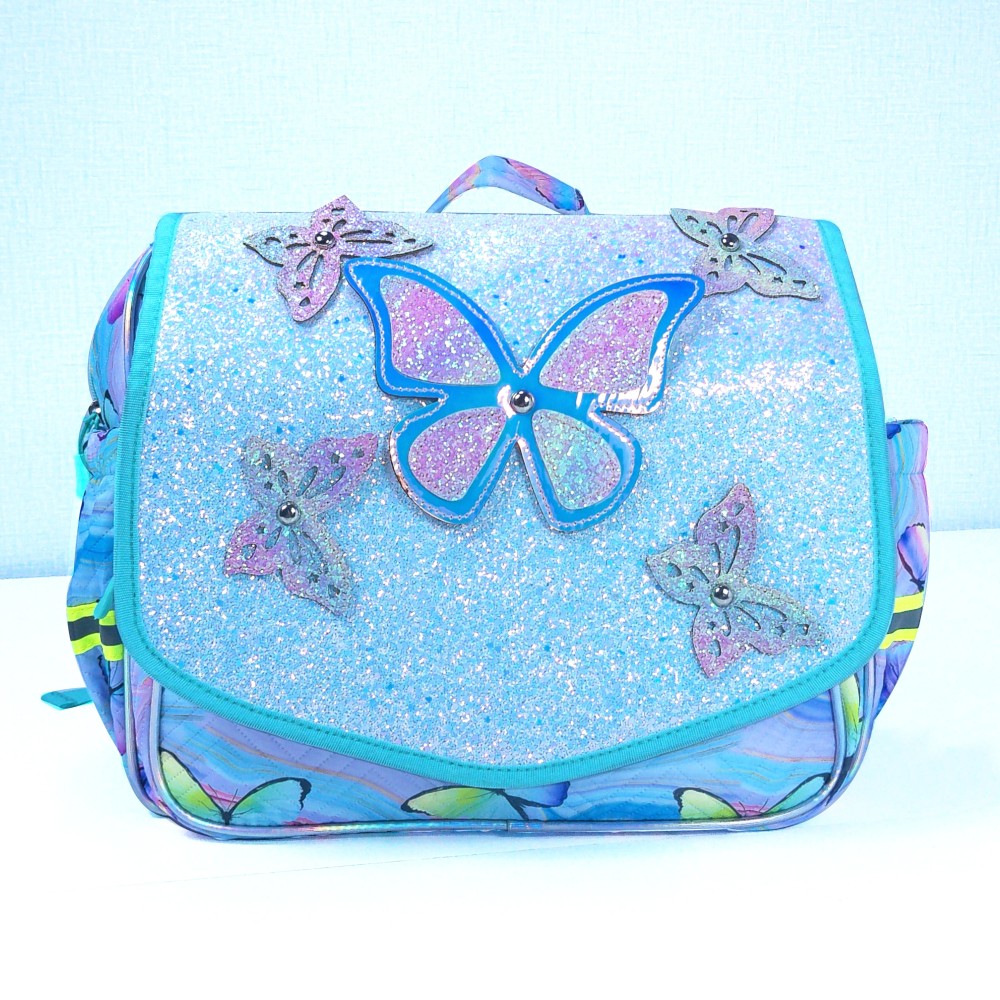 Butterfly decorations, flip-top covers, and student schoolbags