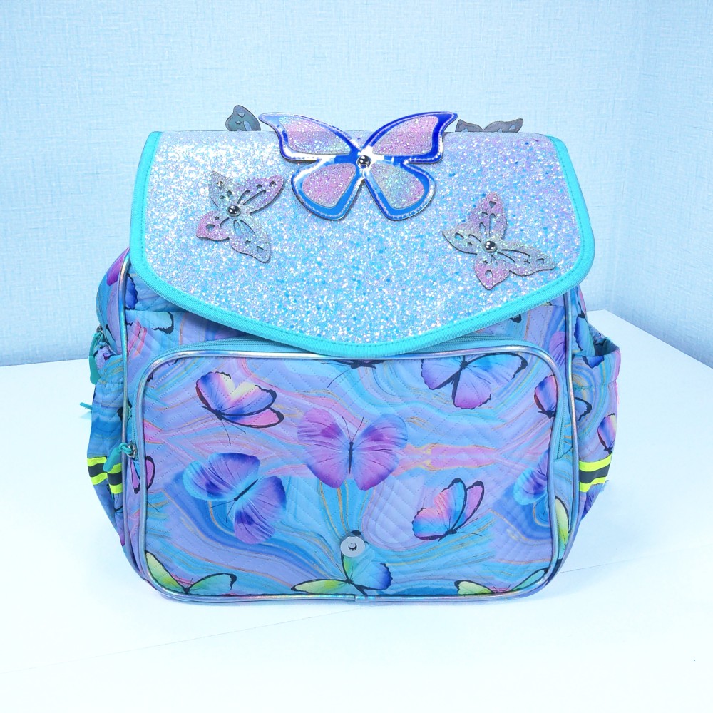 Butterfly decorations, flip-top covers, and student schoolbags