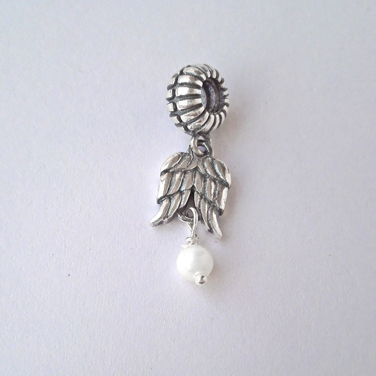 pandora s925 ale sterling silver & pearl angel wings charm in pouch/box