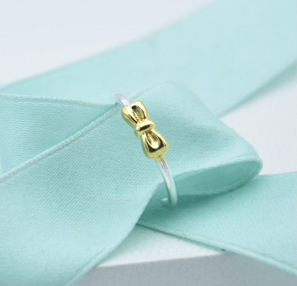 pandora gold bow with silver band ring
