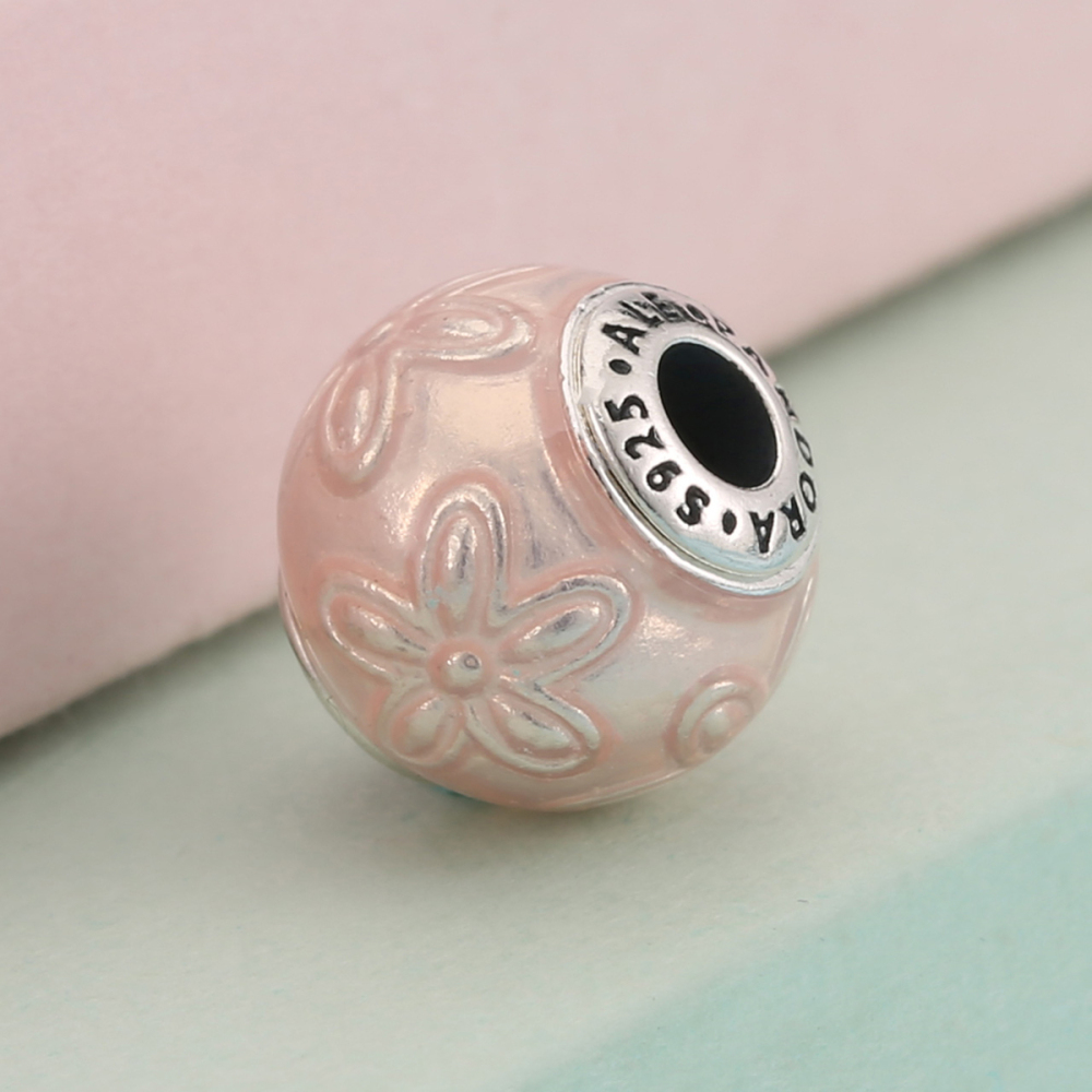 pandora essence happiness charm, a symbolic daisy on pink enamel