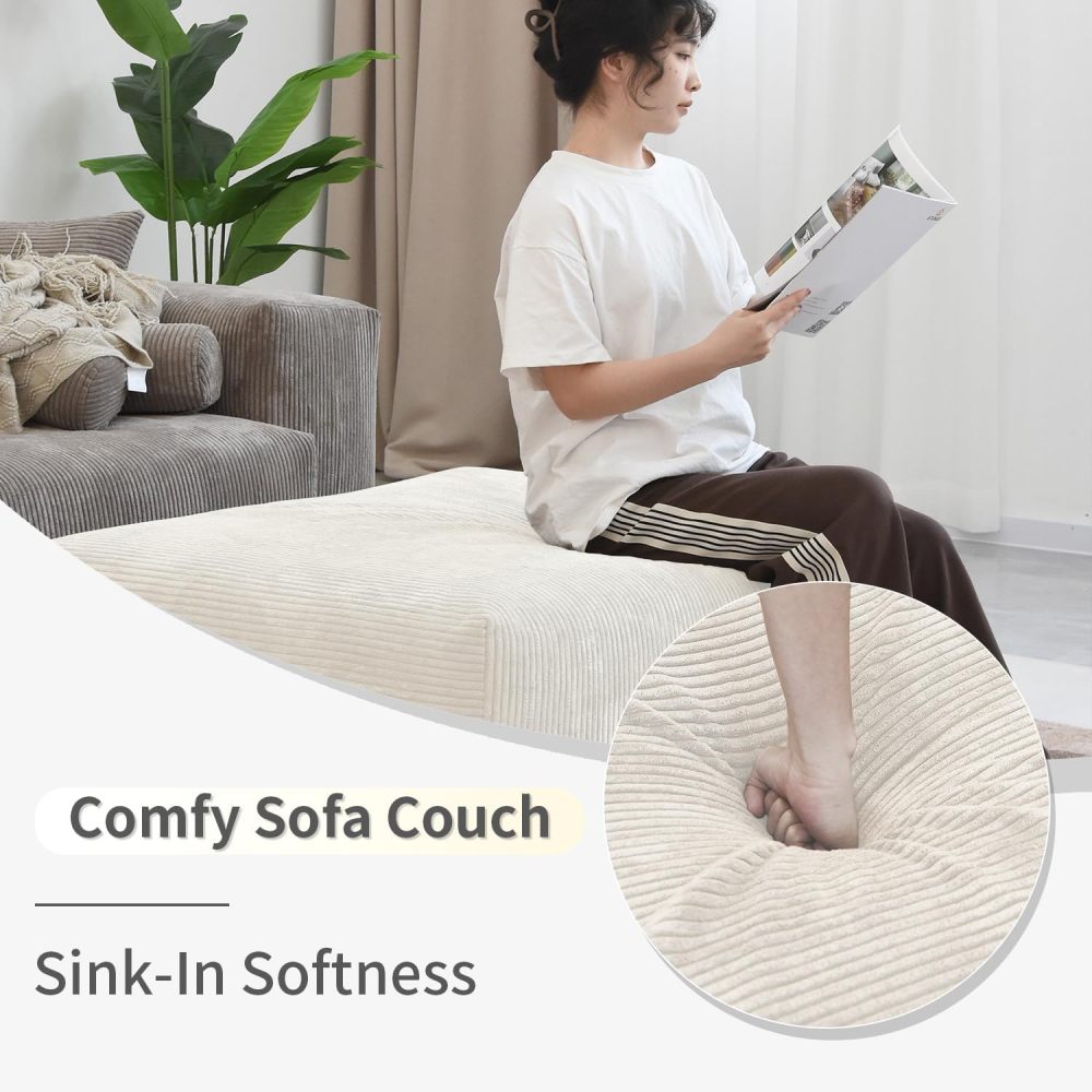 Sofá modular beige de gran tamaño con chaise longue y otomana