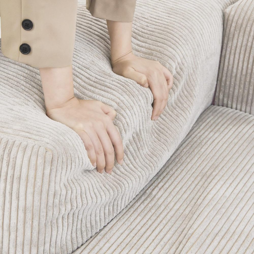 Sofá modular beige de gran tamaño con chaise longue y otomana