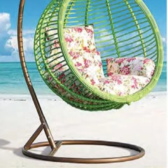 Relaxing Oceanside Rattan Swing Chair with Floral Cushions for Serene Backyard Oasis,Relaxing Oceanside Rattan Swing Chair with Floral Cushions for Serene Backyard Oasis