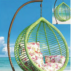 Relaxing Oceanside Rattan Swing Chair with Floral Cushions for Serene Backyard Oasis,Relaxing Oceanside Rattan Swing Chair with Floral Cushions for Serene Backyard Oasis