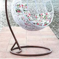 Elegant White Wicker Outdoor Swing Chair with Vibrant Floral Cushion for Garden Tranquility,Stylish Black Rattan Outdoor Swing Chair with Vibrant Floral Cushions for Garden Relaxation