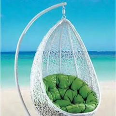 Tranquil Beachside White Wicker Swing Chair with Plush Green Cushion for Coastal Relaxation,Tranquil Beachside White Wicker Swing Chair with Plush Green Cushion for Coastal Relaxation
