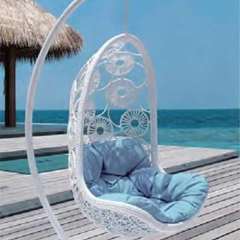 Luxurious White Rattan Swing Chair with Sky Blue Cushion for Seaside Retreat,Rustic Brown Rattan Swing Chair with Sunflower-Inspired Cushion for Garden Comfort