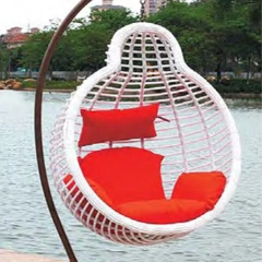 Vibrant White Rattan Swing Chair with Bold Red Cushions for Lakeside Leisure,Vibrant White Rattan Swing Chair with Bold Red Cushions for Lakeside Leisure