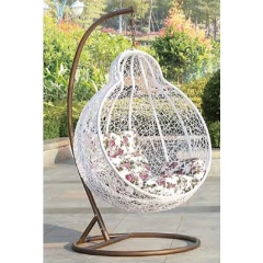 Graceful White Rattan Swing Chair with Delicate Floral Cushion for Backyard Retreat,Graceful White Rattan Swing Chair with Delicate Floral Cushion for Backyard Retreat