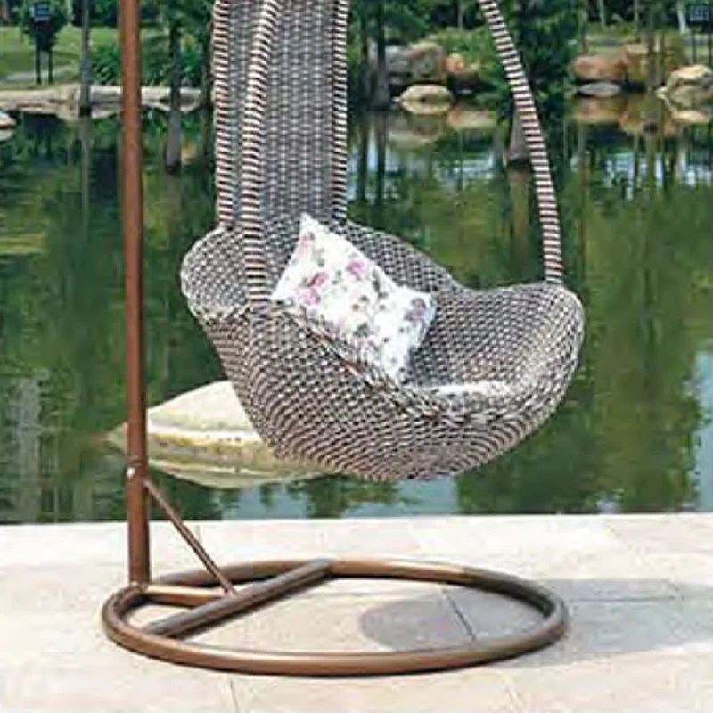 Cozy Brown Rattan Swing Chair with Nature-Inspired Floral Cushion for Outdoor Retreat,Cozy Brown Rattan Swing Chair with Nature-Inspired Floral Cushion for Outdoor Retreat