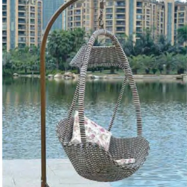 Soothing Brown Rattan Swing Chair with Floral Pattern Cushion for Coastal Relaxation,Soothing Brown Rattan Swing Chair with Floral Pattern Cushion for Coastal Relaxation