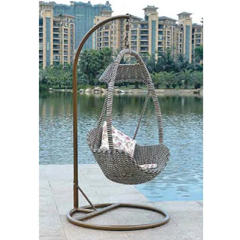Soothing Brown Rattan Swing Chair with Floral Pattern Cushion for Coastal Relaxation,Soothing Brown Rattan Swing Chair with Floral Pattern Cushion for Coastal Relaxation