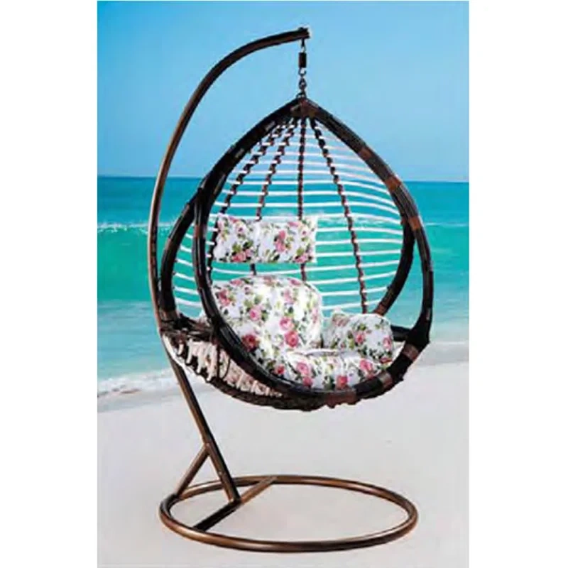 Elegant Dark Rattan Swing Chair with Floral Cushion for Coastal Serenity,Elegant Dark Rattan Swing Chair with Floral Cushion for Coastal Serenity