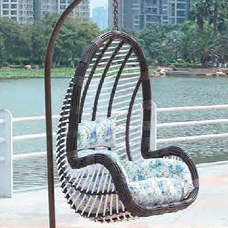 Cozy Dark Rattan Swing Chair with Nature-Inspired Floral Cushion for Backyard Bliss,Cozy Dark Rattan Swing Chair with Nature-Inspired Floral Cushion for Backyard Bliss