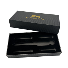 Gold logo printed on black rectangular specialty paper. Optional paper packaging for luxury gift wrapping.