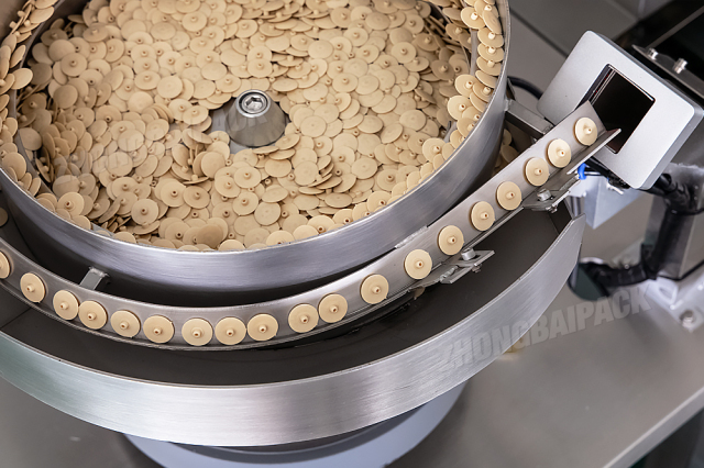 Máquina envasadora de componentes de plástico