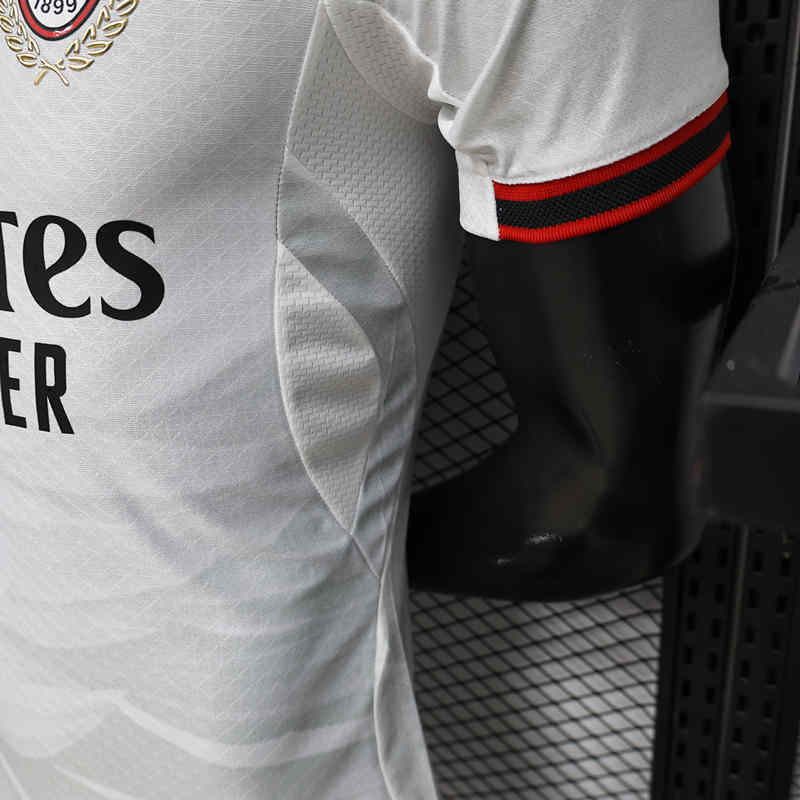 Close-up detail of the AC Milan away jersey fabric and printed accents, showing the lightweight sport finish