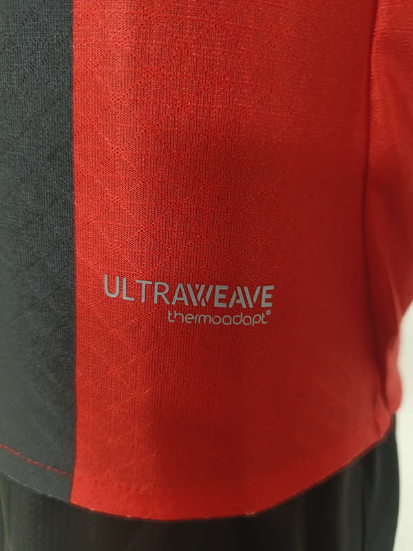 Side angle view of the player version AC Milan home shirt with slim athletic fit