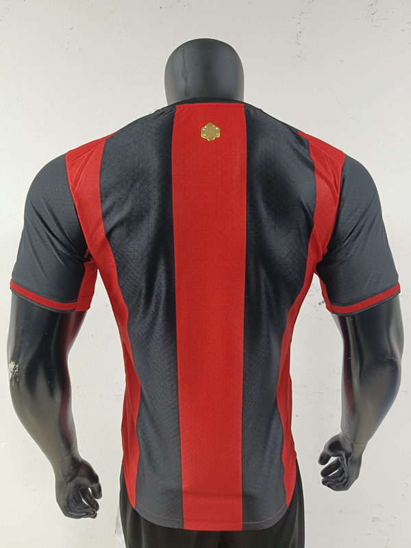 AC Milan style home jersey showing the back view with black and red stripe design