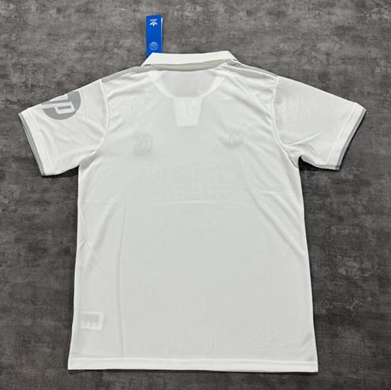 Back view of the white anniversary-style soccer jersey showing a simple, polished layout and comfortable fit
