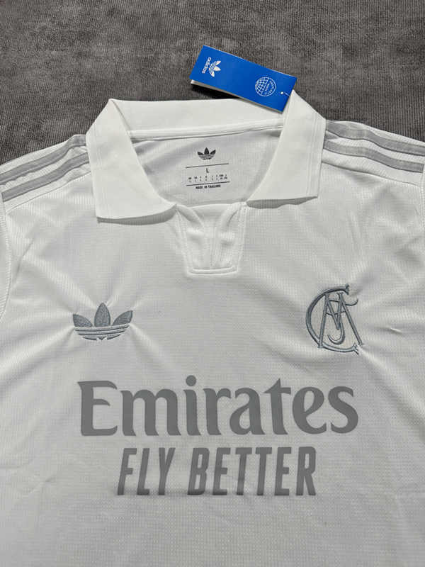 Close-up detail of the jersey fabric and commemorative-inspired accents on the white football shirt