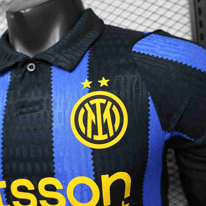 Close-up of the blue and black striped fabric and chest detailing on the replica jersey