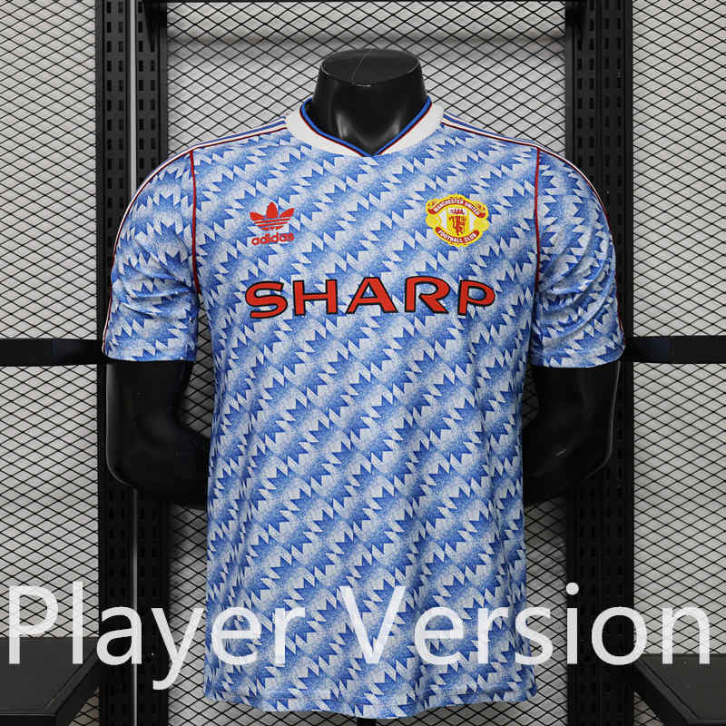 Front view of the Manchester United retro casual blue player version soccer jersey, showing the blue Thailand-style design
