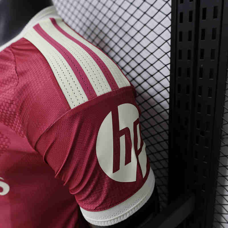 Side angle of the player version shirt highlighting the slim athletic cut and lightweight look
