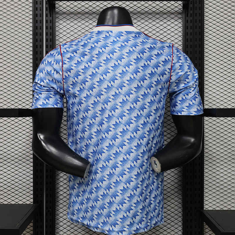 Back view of the Manchester United retro casual blue soccer jersey, highlighting the clean full-panel layout