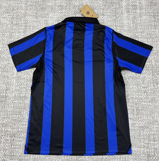 Back view of the Inter Milan blue and black home jersey showing the plain rear panel and full shirt silhouette