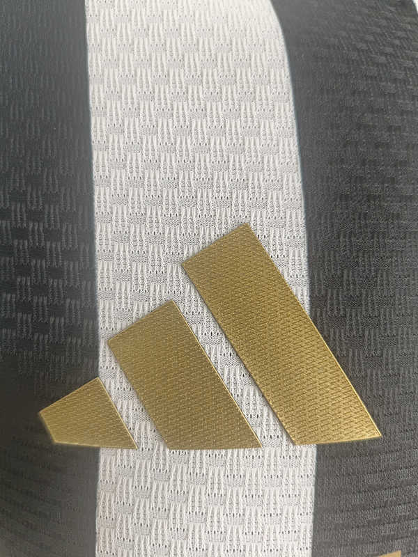 Side angle view of the 26-27 Juventus home soccer shirt highlighting the slim player version cut