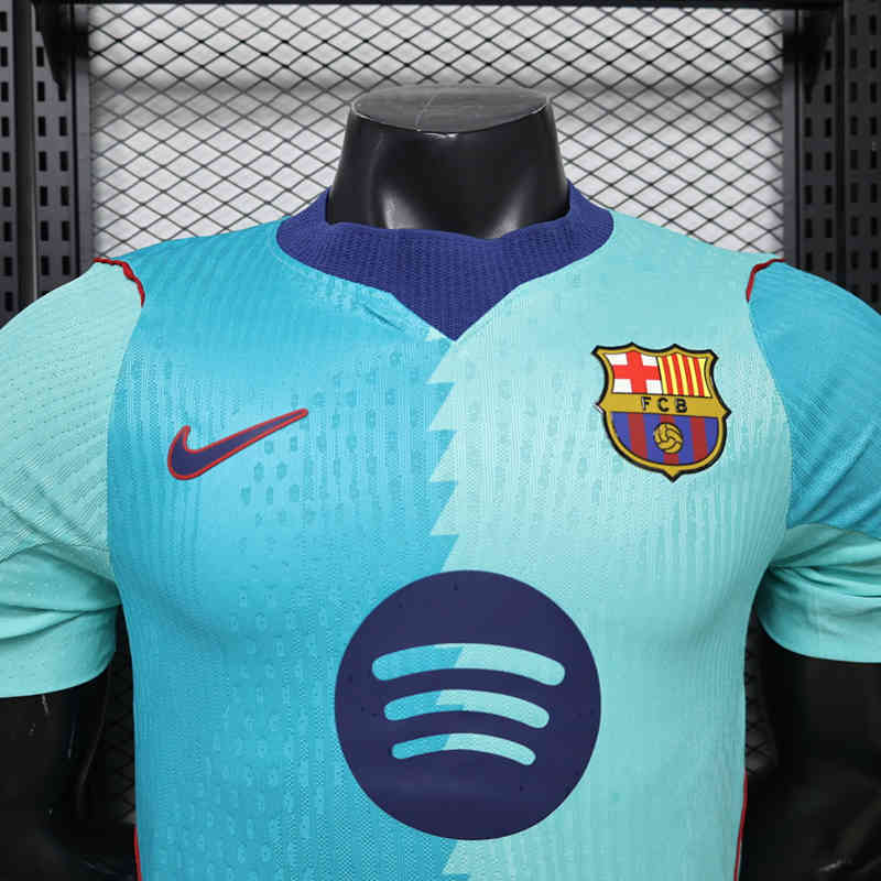 Detail shot of the Barcelona away green jersey collar and upper chest area, emphasizing the styling and finish