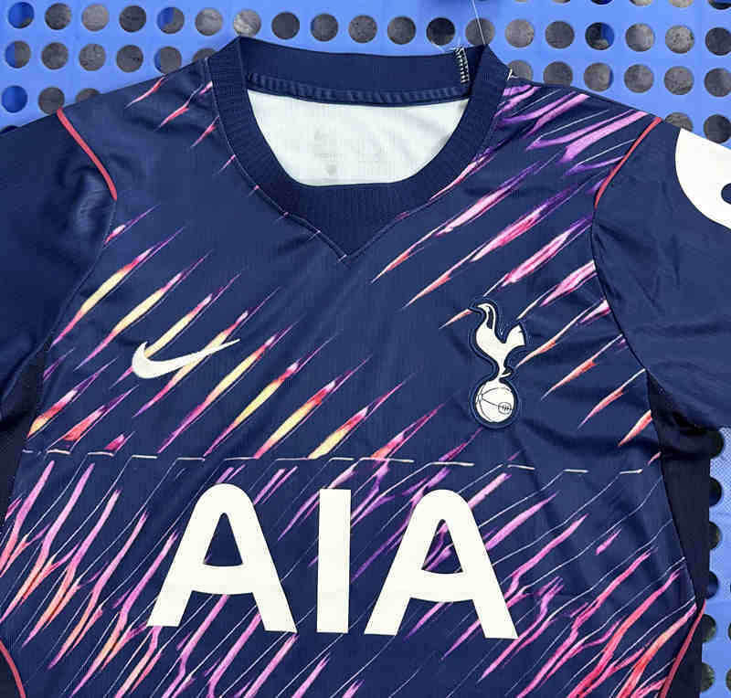 Close-up detail of the Tottenham Hotspur away jersey fabric and printed design elements