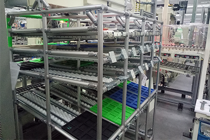 APAS Lean tube flow racks and material handling workstations for industrial assembly