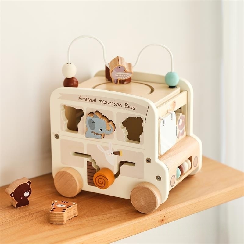 Hexahedral busy box pushcart bus toy