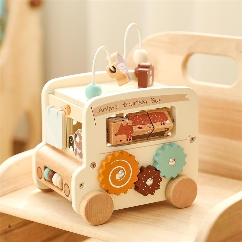 Hexahedral busy box pushcart bus toy