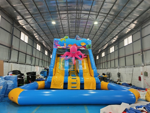 Inflatable slide with pool
