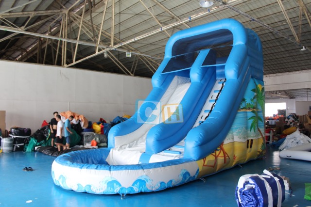 Inflatable swimming pool with slide