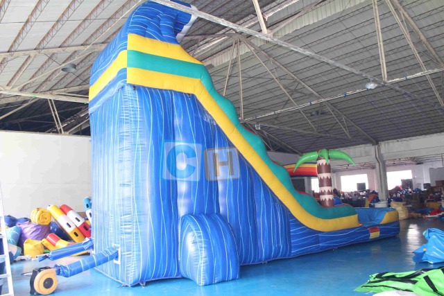 Inflatable swimming pool and slide